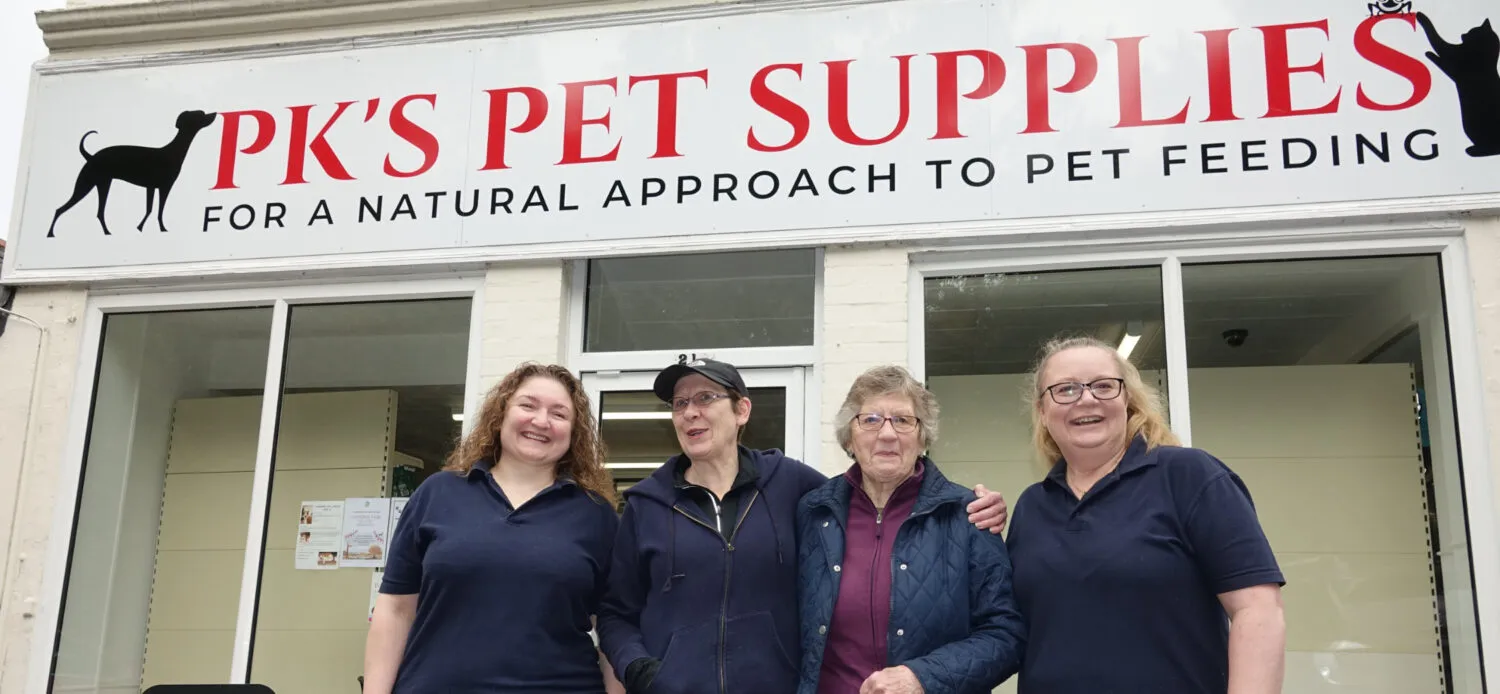 the pks pets team in front of the shop