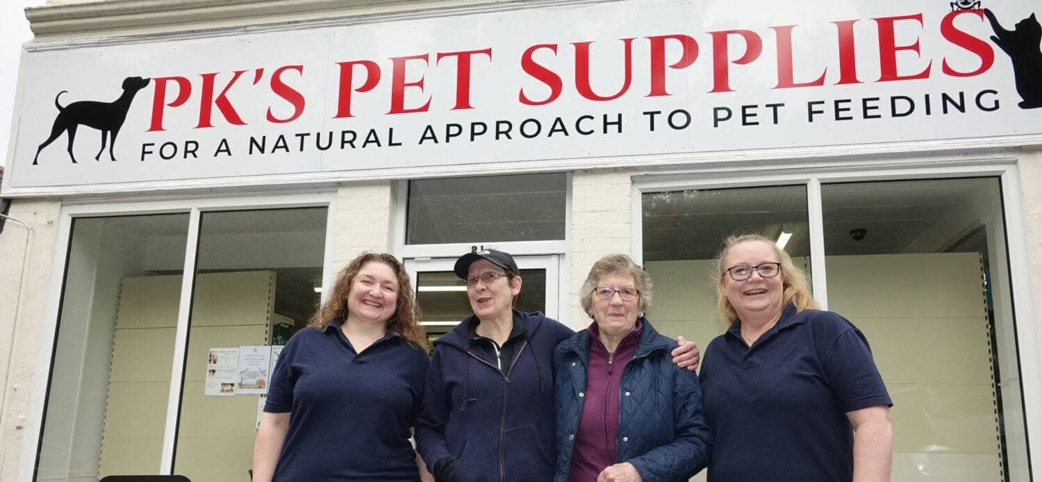 the pks pets team in front of the shop